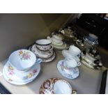 A selection of decorative teaware trios, including Aynsley and Shelley