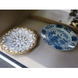 A Meissen design scallop dish having gilt heightened decoration and a 19th century Delft dish having
