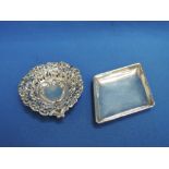 A small Edwardian silver trinket dish of teardrop form having pierced and repousse decoration,