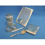 A selection of HM silver items including two napkin rings a glass dressing table pot inscribed Alice