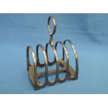 A silver four slice toast rack of plain form, Sheffield 1912, James Deakin & Sons