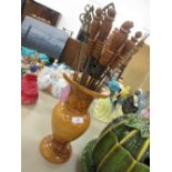 A treen vase and selection of skewers