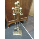 A brass companion stand