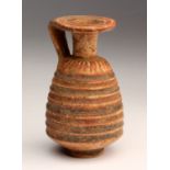 An Etruscan-Corinthian grooved alabastron End of 7th - early 6th century BC; 7,1 cm (2,79 in)