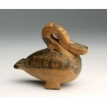 An Etruscan-Corinthian pottery figural unguentarium in the shape of a swan End of 7th - early 6th