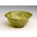 A Roman green glass cup 1st century AD ; 7,4 cm (2,91 in) diameter;  PROVENANCE: From an European