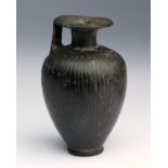 An Etruscan bucchero ware aryballos 7th century BC; 8 cm (3,14 in) high; The whole ovoid body