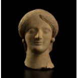 An important terracotta votive head of a Goddess First half of the 5th century BC; 12 cm (4,72 in)