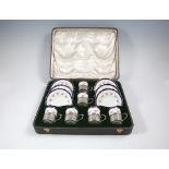 AN AYNSLEY PORCELAIN CASED SIX PIECE COF