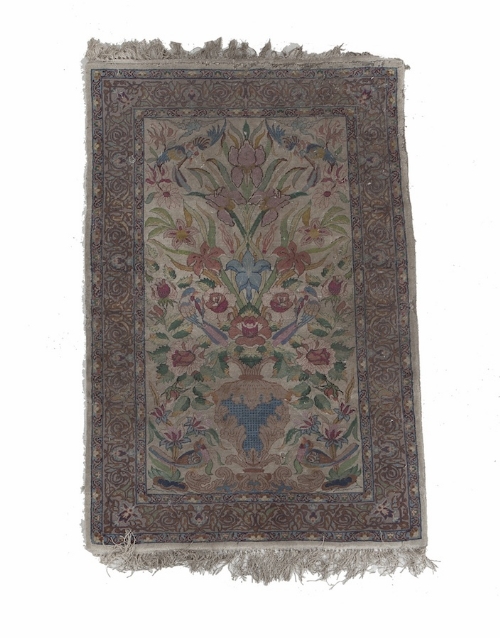 A SMALL PERSIAN WOOL RUG, the central fi