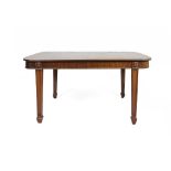 AN IRISH MAHOGANY EXTENDING DINING TABLE