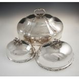 A PAIR OF VICTORIAN SILVER PLATED DOMED DISH COVERS, with detachable leaf cast handles and a