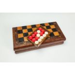 A 19TH CENTURY MOSAIC CHESS AND BACKGAMMON BOX, containing a set of carved bone backgammon counters,