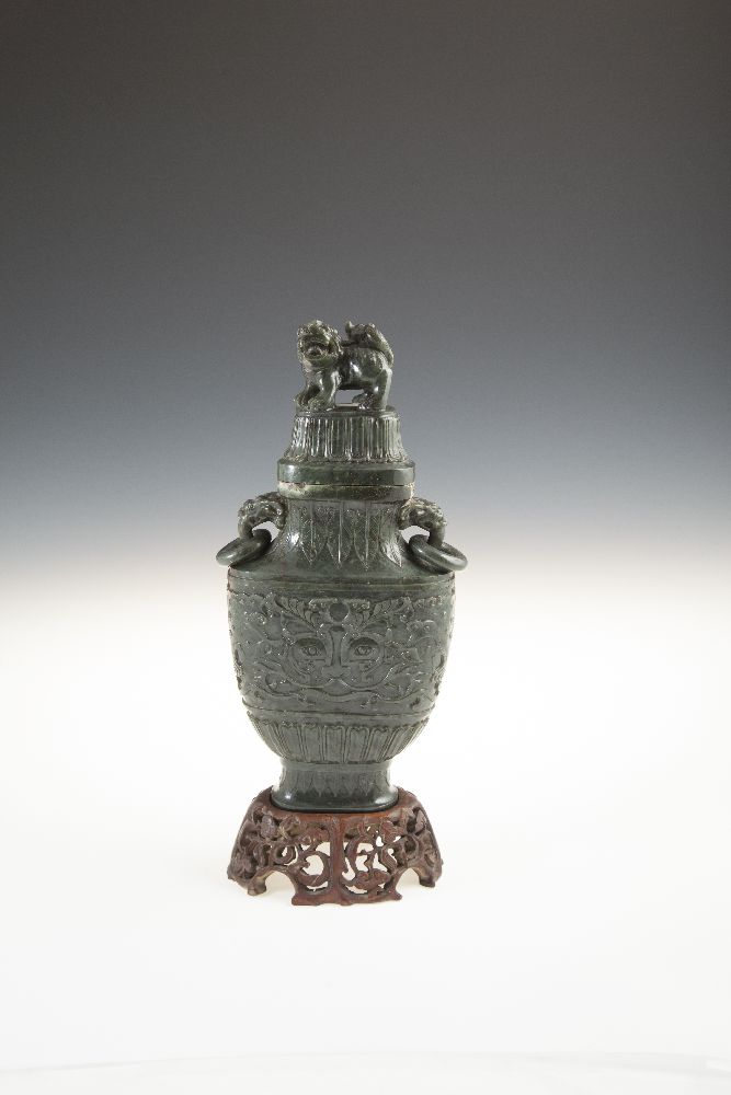 A CHINESE SPINACH JADE VASE AND COVER, late Qianlong, of flattened ovoid shape, the top surmounted