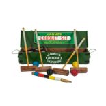 A JAQUES OF LONDON CROQUET SET, modern, with four mallets, hoops, balls and accoutrements, contained