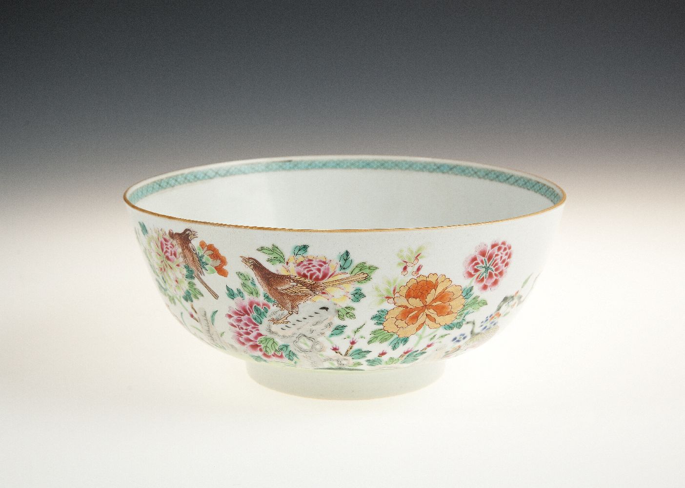 A CHINESE EXPORT PORCELAIN PUNCH BOWL, Qianlong (1736-95) of deep circular form, painted to the