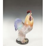 A LARGE POLYCHROME GLAZED EARTHENWARE COCKEREL.Provenance: From a notable German pre-war collection