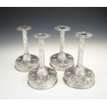 A SET OF FOUR GERMAN SILVER REPOUSSE CANDLESTICKS, Frankfurt 18th century, each fitted with