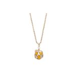 A 14 carat gold and amber pendant of naturalistic design, circular scrolling vines set to centre