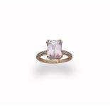 A diamond and kunzite ring, the rectangular mixed-cut kunzite within a double four-claw setting,