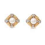 A pair of cultured pearl, and 18 carat gold earrings, each set to centre with a cultured pearl
