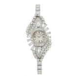A diamond wristwatch by Enicar, Circa 1950s, the circular silvered dial with baton indexes, the