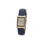 A Gentleman's 18 carat gold Reverso wristwatch by Jaeger LeCoultre, the rectangular cream dial