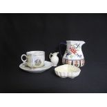 A Victorian mustache cup and saucer; a B