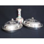 A pair of plated oval entree dishes and