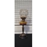 An Edwardian brass mounted oil lamp with