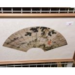 A Chinese silk fan with printed scene, mounted and framed.