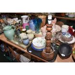 Two trays including carved wooden table lamp, modern glass stand, studio pottery etc