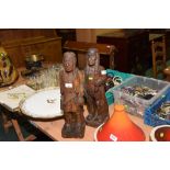 A pair of carved wooden Native American figures