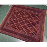 A tribal Kazak rug. 1.18m by 1.22m