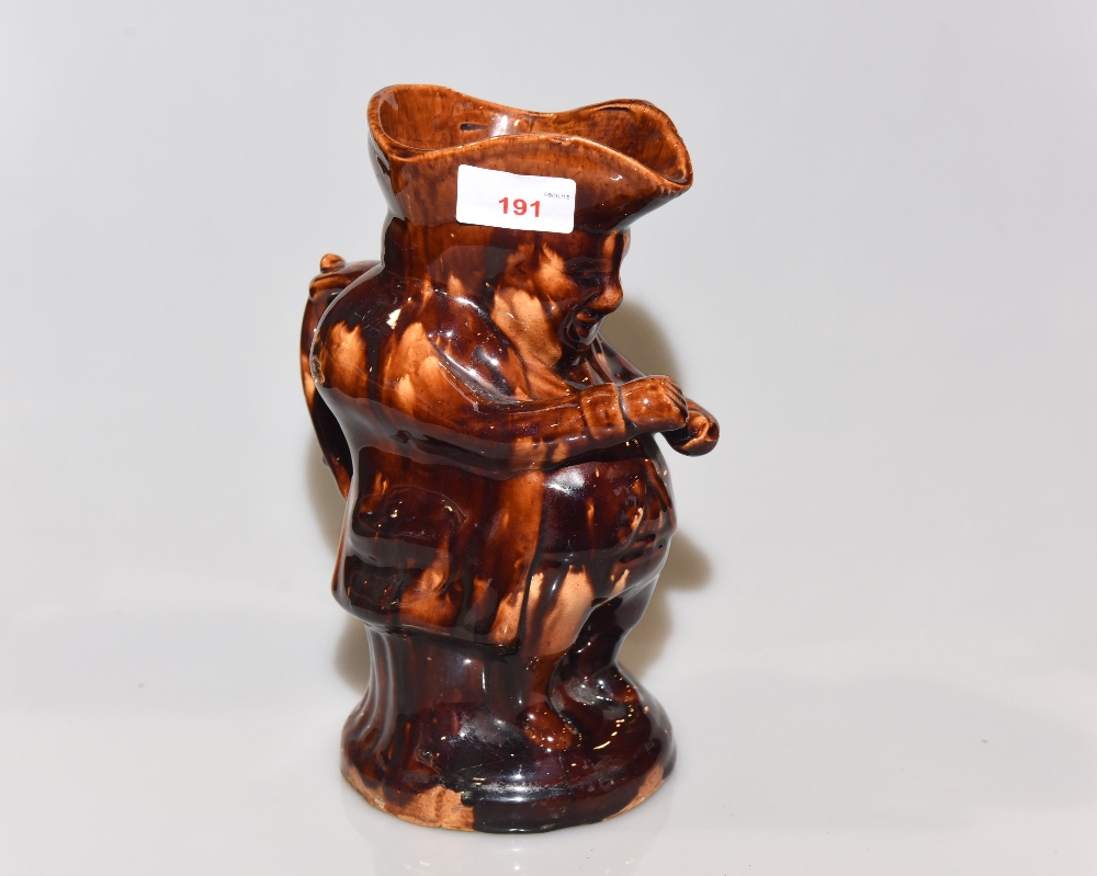 A 19th century treacle glazed toby jug
