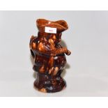 A 19th century treacle glazed toby jug