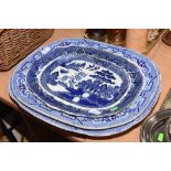 Three late 19th/early 20th century blue and white Willow pattern meat plates, largest 54cm wide