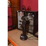 A patinated metal table lamp in the Art Nouveau taste.