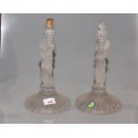 A pair of 20th Century Baccarat glass lamp stands with figure of a child holding a lantern, (