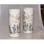 A pair of Chinese porcelain cylindrical vases, decorated with figures in landscapes, height 28cm