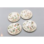 A group of 18th Century Chinese famille rose floral saucers, three signed with painted four