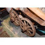 Two iron bound wooden cart wheels