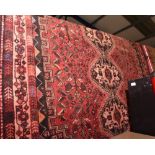 A large Shiraz rug, c. 1950-60, 3m by 2.05m