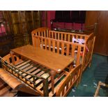 An early 20th century brass framed double bed