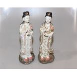 A pair of Chinese stoneware Guan Yin figures, each with impressed four character mark to base.