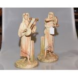 A pair of James Hadley Worcester porcelain figures of Eastern Musicians, in blush ivory, one holding