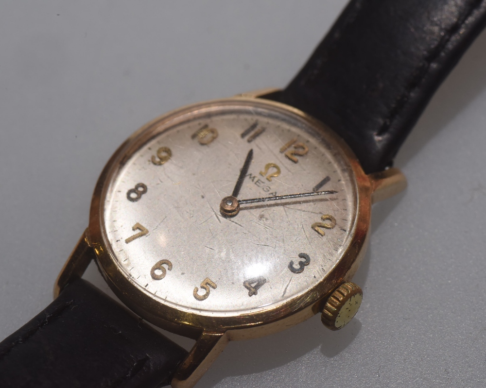 A vintage lady's 9ct gold Omega wristwatch, stamped marks, on a leather strap with Omega buckle