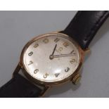 A vintage lady's 9ct gold Omega wristwatch, stamped marks, on a leather strap with Omega buckle