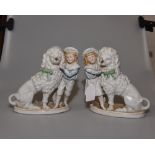 A pair of 19th century Continental bisque figures of a boy and girl, 19cm high