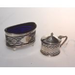 An Edwardian silver salt with pierced decoration and blue glass liner, Chester 1902, tog with a